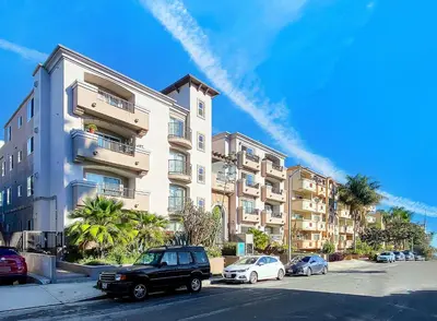 a car parked in front of a large building at Amazing & Spacious in Heart of Santa Monica- Easy Access to ALL Tourist attractions in Los Angeles