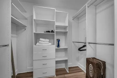 a closet with white drawers and white shelves at Amazing Spacious Unit in Heart of LA- Melrose district in Los Angeles