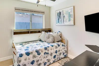 a bedroom with a bed and a flat screen tv at Newly Updated! Commuter-Friendly Anaheim Home in Anaheim