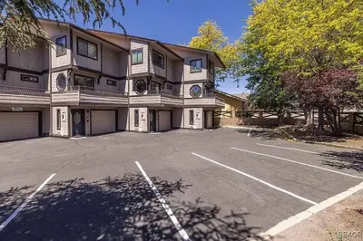 a large building with a parking lot in front of it at Lake Forest Shores at Big Bear Lake in Big Bear Lake