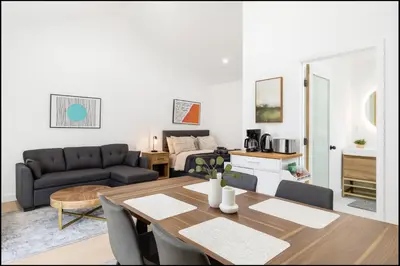 a living room with a table and a couch at South Pasadena Studio Spa Escape in South Pasadena