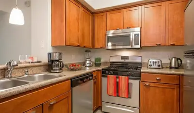 a kitchen with a sink and a stove and microwave at Marina del Rey Family 1BA & 2BA - Pool, Spa and Gym Access in Los Angeles