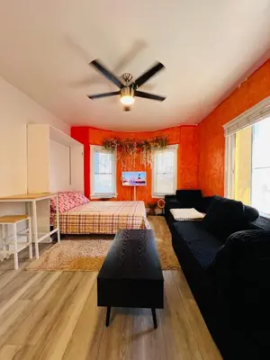 a living room with a couch and a ceiling fan at Beautiful Venice Beach in Los Angeles