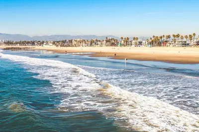a view of a beach with the ocean and buildings at Beautiful Venice Beach in Los Angeles
