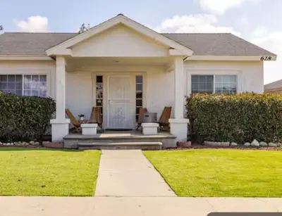 a house with two chairs and a porch at CA5 House Cozy 3BR in Azusa in Azusa