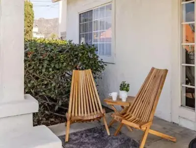 two chairs and a table in front of a house at CA5 House Cozy 3BR in Azusa in Azusa