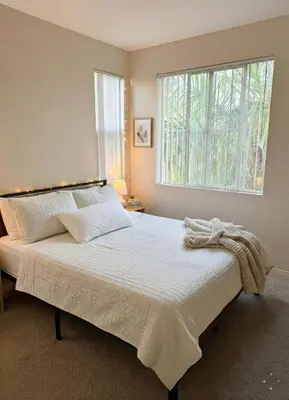 a bedroom with a large bed with a window at Marina Del Rey View 1BA & 2BA in MDR - Pool, Jacuzzi, Gym in Los Angeles