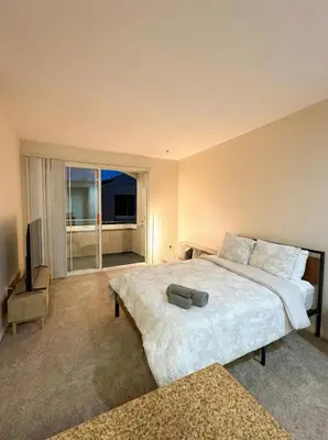 a bedroom with a large bed and a large window at Marina Del Rey View 1BA & 2BA in MDR - Pool, Jacuzzi, Gym in Los Angeles