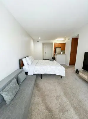 a large bedroom with a bed and a couch at Marina Del Rey View 1BA & 2BA in MDR - Pool, Jacuzzi, Gym in Los Angeles