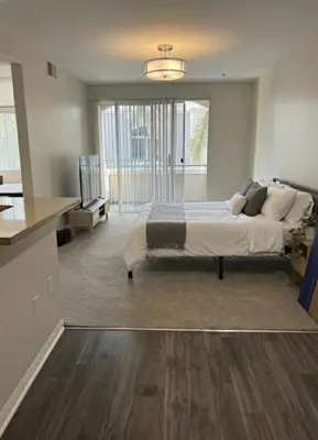 a bedroom with a large bed and a large window at Marina del Rey 1BA & 2BA Getaway - Pool - Spa - Gym in Los Angeles