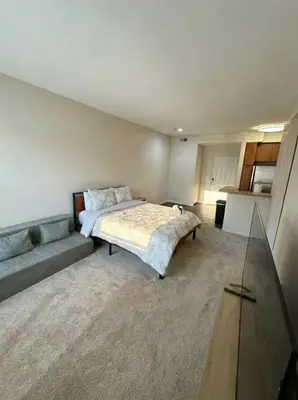 a bedroom with a bed and a couch in it at Marina del Rey 1BA & 2BA Getaway - Pool - Spa - Gym in Los Angeles
