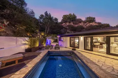 a swimming pool in the backyard of a house at Shirley Lane in Los Angeles
