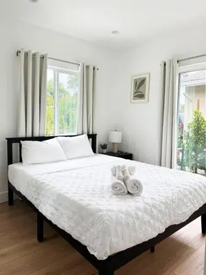 a bedroom with a large bed with two towels on it at Relaxing 2BR Escape in Trendy West LA - CM-CAL in Calabasas