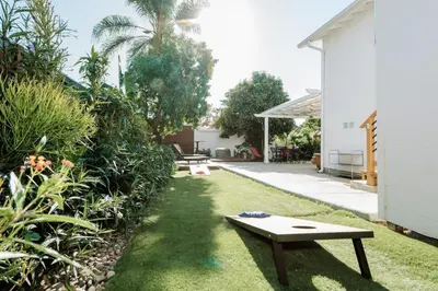 a backyard with a bench in the grass at Serene Silver Lake 1 bedroom 1 bathroom Back house With Private Backyard in Los Angeles