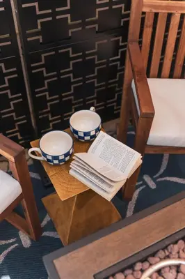 a table with two cups and a book on it at Renovated Stylish Guesthouse By Claremont With Private Patio in Montclair