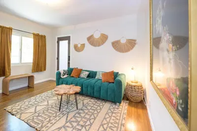 a living room with a green couch and a table at Charming and Cozy 1 Bedroom 1 Bathroom Guest Suite in Silverlake in Los Angeles
