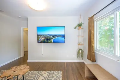 a living room with a tv on a wall at Charming and Cozy 1 Bedroom 1 Bathroom Guest Suite in Silverlake in Los Angeles