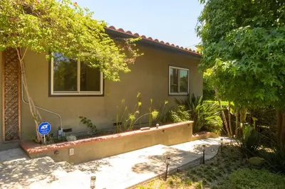 a house with a street sign in front of it at Charming and Cozy 1 Bedroom 1 Bathroom Guest Suite in Silverlake in Los Angeles