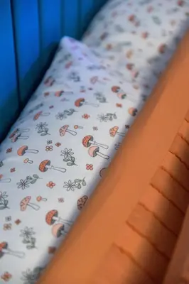 a bed with a bedsheet with bugs on it at Charming and Cozy 1 Bedroom 1 Bathroom Guest Suite in Silverlake in Los Angeles