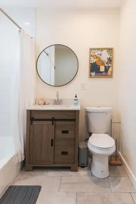 a bathroom with a toilet and a mirror at Renovated 1 Bedroom 1 bathroom Cottage Near Larchmont Village in Los Angeles