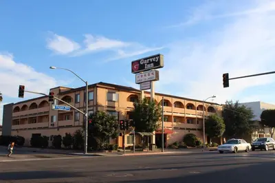 a street corner with a street sign and a building at Garvey Inn Hotel - \u5c0f\u53f0\u5317\u9152\u5e97, Monterey Park in Monterey Park