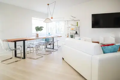 a living room with a white couch and a table at Beauty And The Beach in Ventura