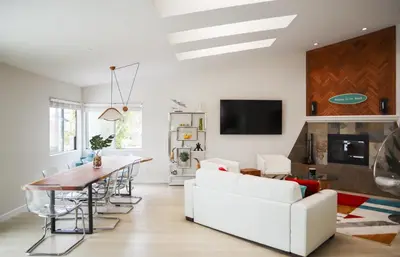 a living room with a white couch and a table at Beauty And The Beach in Ventura