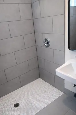 a bathroom with a shower with a sink at La Cienega Soul in Los Angeles