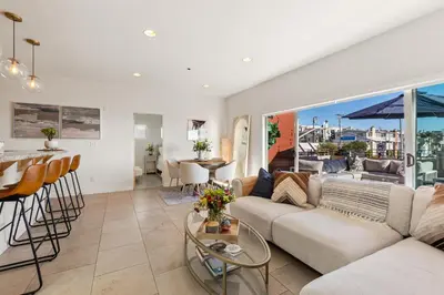 a living room with a couch and a table at Ocean View condo in the heart of Manhattan Beach in Manhattan Beach