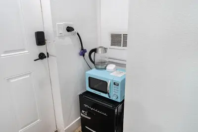 a microwave and a blender on top of a dresser at Hollywood Hills Retreat - Next to Universal Studios in Los Angeles