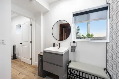 a bathroom with a sink and a mirror at Hollywood Hills Retreat - Next to Universal Studios in Los Angeles
