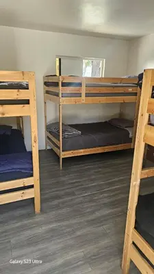a room with three bunk beds in it at The Vibe in Los Angeles