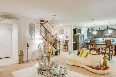 a living room with a couch and a dining room at 4 Mi to CSUB Campus Spacious Home with Yard in Bakersfield