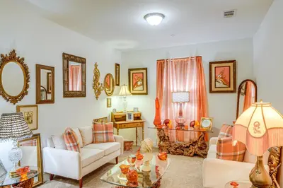 a living room with a couch and a table at 4 Mi to CSUB Campus Spacious Home with Yard in Bakersfield
