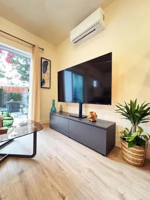 a living room with a large flat screen tv at Chic Studio Haven by Century City - FH2 - BV in Los Angeles