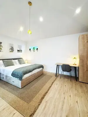 a bedroom with a bed and a desk and a table at Chic Studio Haven by Century City - FH2 - BV in Los Angeles