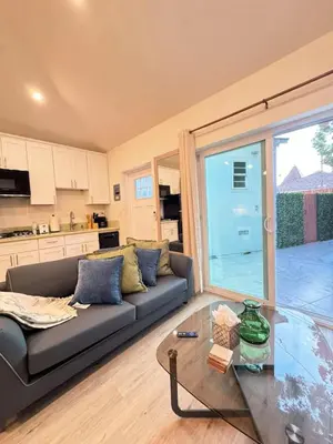 a living room with a couch and a glass table at Chic Studio Haven by Century City - FH2 - BV in Los Angeles