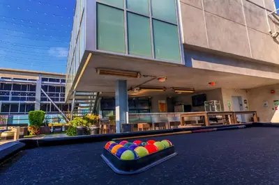 a pool table with balls in front of a building at Modern 2BR Loft with Luxury Amenities - 109 - GL in Glendale
