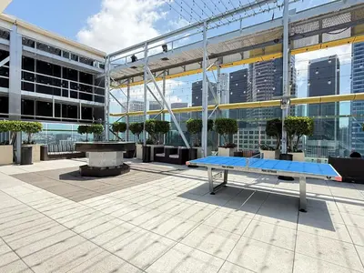 a ping pong table in front of a building at Luxury Loft Living 1BR in Trendy Complex -113-GL in Glendale