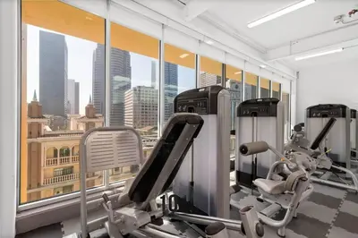 a gym with cardio machines and a view of the city at Luxury Loft Living 1BR in Trendy Complex -113-GL in Glendale