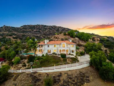 an aerial view of a house on a hill at Mountain View Luxury Estate with Pool in West Hills in Chatsworth Lake Manor