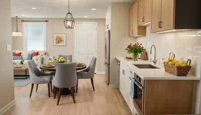 a kitchen and dining room with a table and chairs at Chic Residences Steps from Beverly Hills & Sony Pictures in Los Angeles