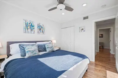 a bedroom with a bed and a ceiling fan at Charming Modern Escape with Outdoor Living in San Dimas