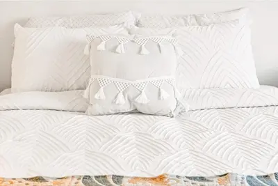 a white bed with white pillows on it at Lux Marina Village with parking in Los Angeles