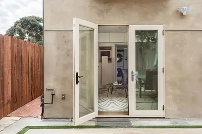 an open door of a house with a patio at Garden Oasis by the Sea in Los Angeles