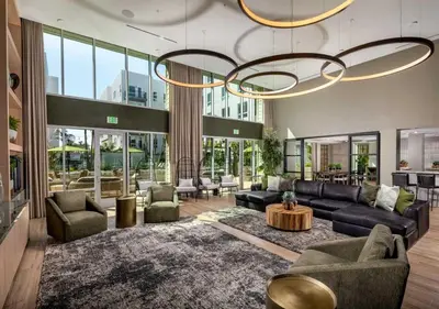 a living room with couches and a chandelier at Charming 2BR Retreat Pool Gym 10min to Disneyland in Santa Ana