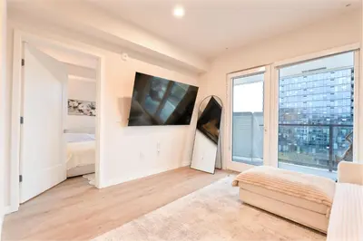 a bedroom with a bed and a large window at Elevated Escape Luxury 1BR in Hollywood in Los Angeles