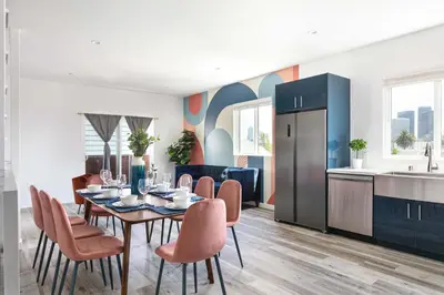 a kitchen and dining room with a table and chairs at Central 4BR Townhome Modern Perks in Los Angeles