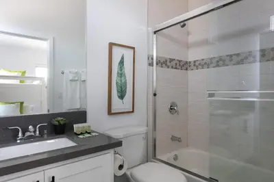 a bathroom with a shower and a toilet and a sink at 3BR Urban Retreat with Modern Amenities in Los Angeles