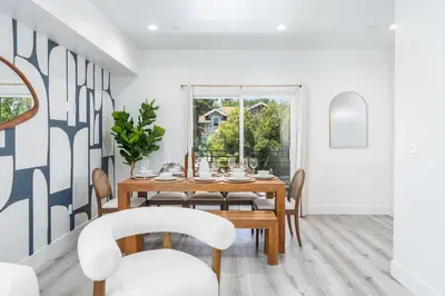 a dining room with a table and chairs at Sunset Views from Private Rooftop in Luxe Townhome in Los Angeles